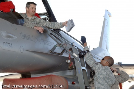 p>ELLINGTON FIELD, Texas - Tech. Sgt. Chris Hase takes a technical manual from Staff Sgt. Christopher Boyd during a weapons download and functional test of an F-16 fighter during an Amalgam Mute inspection March 15. As well as inspecting a unit's ability to employ and control aircraft, North American Aerospace Defense Command Inspector General personnel also inspect and grade the unit on their ability to maintain and reconstitute their aircraft following a mission. Hase and Boyd are aircraft armament systems specialists with the 138th Fighter Wing, Detachment 1.