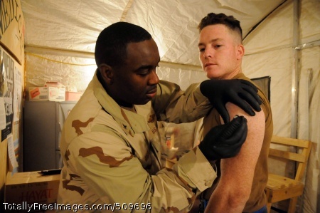 100917-N-0475R-126
HELMAND PROVINCE, Afghanistan (Sept. 16, 2010) Builder Constructionman Nathan Crowell, right, assigned to Naval Mobile Construction Battalion (NMCB) 5, receives his annual influenza vaccination from Hospital Corpsman 3rd Class Orlando Green at Camp Leatherneck, Afghanistan. The Seabees of NMCB-5 are deployed to Afghanistan executing general engineering, infrastructure construction and project management supporting Operation Enduring Freedom. (U.S. Navy photo by Mass Communication Specialist 2nd Class Ace Rheaume/Released) 