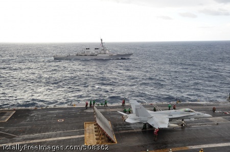 101026-N-3418M-123
PACIFIC OCEAN (Oct. 26, 2010) The aircraft carrier USS George Washington (CVN 73) conducts routine flight operations while the Arleigh Burke-class guided-missile destroyer USS Stethem (DDG 63) transits nearby. George Washington is on its 2010 Fall patrol in the western Pacific Ocean. (U.S. Navy photo by Mass Communication Specialist 3rd Class Marcus D. Mince/Released) 