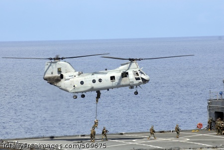 100918-N-8335D-500
PHILIPPINE SEA (Sept. 18, 2010) Marines assigned to the 31st Marine Expeditionary Unit (31st MEU) embarked aboard the amphibious assault ship USS Essex (LHD 2) fast rope from a CH-46 Sea Knight helicopter onto the Military Sealift Command dry cargo and ammunition ship USNS Alan Shepard (T-AKE 3) during a visit, board, search and seizure exercise. Essex is on patrol in the western Pacific Ocean and is part of the permanently forward-deployed Essex Amphibious Ready Group participating in Valiant Shield 2010, an integrated joint-training exercise designed to enhance interoperability between U.S. forces. (U.S. Navy photo by Mass Communication Specialist 1st Class Richard Doolin/Released) 