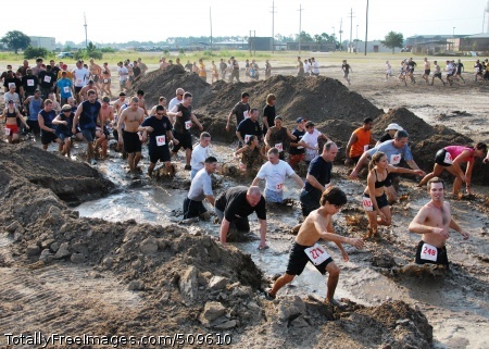100918-N-7084M-233
GULFPORT, Miss. (Sept. 18, 2010) Participants in the 15th annual Seabee Volkslauf Mud Run trudge through one of the first obstacles of the five-mile course at Naval Construction Battalion Center. More than 1,000 people participated in this year's mud run, raising more than $27,000 to help fund the 2011 Seabee Ball. (U.S. Navy photo by Equipment Operator 3rd Class Mikayla Mondragon/Released)