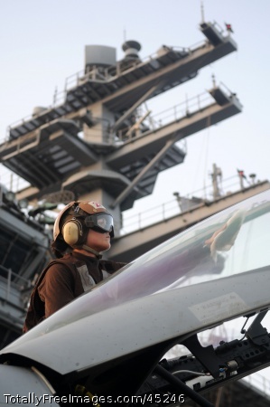 U.S. Navy Petty Officer 3rd Class Courtney Powers, a plane
