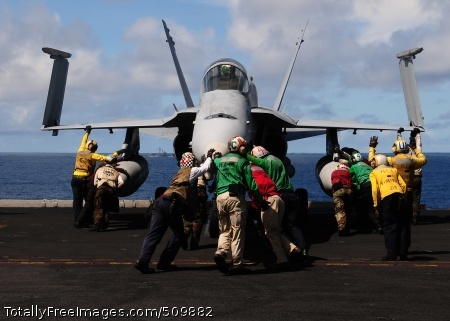 100911-N-3327M-085
PACIFIC OCEAN (Sept. 11, 2010) Sailors assigned to the Sidewinders of Strike Fighter Squadron (VFA) 86 push an F/A-18C Hornet into parking position after an arrested landing aboard the aircraft carrier USS Nimitz (CVN 68). Nimitz is conducting blue water operations in the U.S. 3rd Fleet area of responsibility. (U.S. Navy photo by Mass Communication Specialist 2nd Class James Mitchell/Released)