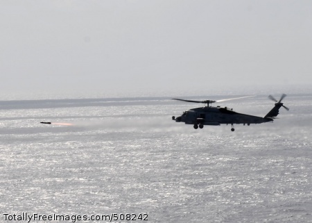 101026-N-3374C-225
ATLANTIC OCEAN (Oct. 26, 2010) An MH-60R Sea Hawk helicopter assigned to Helicopter Maritime Strike Squadron (HSM) 70 embarked aboard the guided-missile cruiser USS Gettysburg (CG 64), fires an AGM-114 Hellfire missile during a sinking exercise. Gettysburg is part of the George H.W. Bush Carrier Strike Group and is participating in an exercise in the Atlantic Ocean. (U.S. Navy photo by Mass Communication Specialist 3rd Class Tony Curtis/Released) 