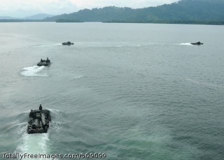 101005-N-7680E-060
CHIRIQUI GRANDE, Panama (Oct. 5, 2010) Amphibious assault vehicles (AAV) assigned to Alpha Company of the 2nd Assault Amphibian Battalion transit away from the multi-purpose amphibious assault ship USS Iwo Jima (LHD 7). Service members aboard Iwo Jima took rides on the AAVs as an opportunity to experience an amphibious landing. Iwo Jima is supporting the Panama phase of the Continuing Promise 2010 humanitarian civic assistance mission. The assigned medical and engineering staff embarked aboard Iwo Jima are working with partner nations to provide medical, dental, veterinary, and engineering assistance in eight countries. (U.S. Navy photo by Mass Communication Specialist 2nd Class Zane Ecklund/Released) 
