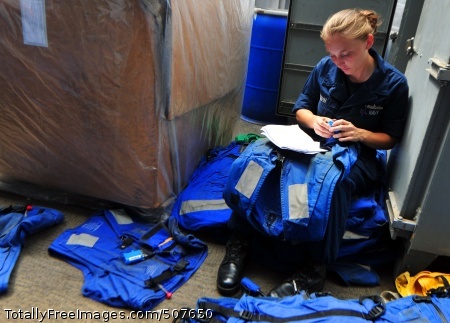 101018-N-7948R-255
GULF OF ADEN (Oct. 18, 2010) Logistics Specialist Seaman Amber Hahn takes inventory of float coats aboard the amphibious dock landing ship USS Pearl Harbor (LSD 52). Pearl Harbor is part of Combined Task Force (CTF) 151, a multinational task force established in January 2009 to conduct counter-piracy operations in and around the Gulf of Aden and Somali Basin. (U.S. Navy photo by Mass Communication Specialist 2nd Class Michael Russell/Released)