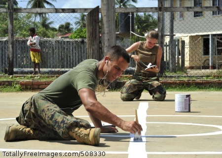 101025-N-1531D-053
NEW AMSTERDAM, Guyana (Oct. 25, 2010) Marine Cpl. Gabriel Castaneda, left, from Miami, assigned to Special Purpose, Marine Air Ground Task Force, and Steelworker Constructionman Lindzie Bicknell, from St. Maries, Idaho, assigned to Construction Maintenance Building Unit 202 of Naval Mobile Construction Battalion (NMCB) 7, paint lines for a new basketball court during a Continuing Promise 2010 engineering community service event. The two are embarked aboard the multi-purpose amphibious assault ship USS Iwo Jima (LHD 7) conducting the Continuing Promise 2010 humanitarian civic assistance mission. The assigned medical and engineering staff embarked aboard Iwo Jima will work with partner nation teams to provide medical, dental, veterinary and engineering assistance in eight countries. (U.S. Navy photo by Mass Communication Specialist 2nd Class Jonathen E. Davis/Released) 