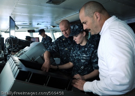 100925-N-2821G-065
PACIFIC OCEAN (Sept. 25, 2010) Senior Chief Quartermaster James Fox and Quartermaster 2nd Class Sarah DeGraw, explain surface contact radar aboard the aircraft carrier USS Abraham Lincoln (CVN 72) to Rear Adm. Mark D. Guadagnini, commander of the Abraham Lincoln Carrier Strike Group. Guadagnini spent the morning touring Abraham Lincoln's navigation department spaces and learned about their tools and equipment. Abraham Lincoln Carrier Strike Group is on a scheduled deployment to the U.S. 7th and 5th Fleet areas of responsibility supporting maritime security operations and theater security cooperation efforts to establish conditions for regional stability. (U.S. Navy photo by Mass Communication Specialist 2nd Class Alan Gragg/Released) 