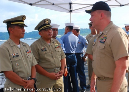 101016-N-3589B-020
SUBIC BAY, Philippines (Oct. 16, 2010) Cmdr. Troy Amundson, right, speaks with members of the Philippine navy before a closing ceremony for Cooperation Afloat Readiness and Training (CARAT) aboard the guided-missile destroyer USS Halsey (DDG 97). CARAT is a series of bilateral exercises held annually in Southeast Asia to strengthen relationships and promote maritime security. (U.S. Navy photo by Mass Communication Specialist 2nd Class Jessica Bidwell/Released) 
