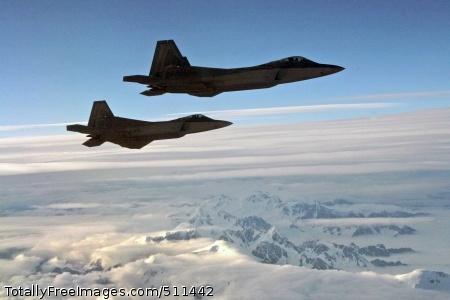 VER ALASKA - A pair of F-22 fighters escort Fencing 1220, a Gulfstream 4 simulating a hijacked airliner, over Alaska as part of Exercise VIGILANT EAGLE Aug. 8. VIGILANT EAGLE is a cooperative exercise involving the North American Aerospace Defense Command and the Russian Air Force. The exercise scenario creates a situation that requires both the Russian Air Force and NORAD to launch or divert fighter aircraft to investigate and follow a "hijacked" airliner. The exercise focuses on shadowing and the cooperative hand-off of the monitored aircraft between fighters of the participating nations.