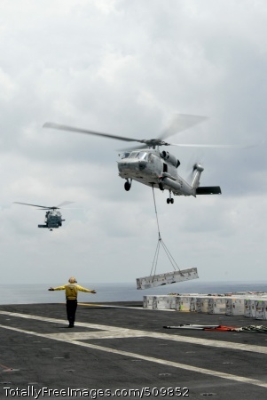 100914-N-1638S-126
PACIFIC OCEAN (Sept. 14, 2010) An SH-60F Sea Hawk helicopter assigned to the Indians of Helicopter Anti-Submarine Squadron (HS) 6 airlifts ordnance from the flight deck of the aircraft carrier USS Nimitz (CVN 68) during an ammunition offload. Nimitz is conducting blue water operations in the U.S. 3rd Fleet area of responsibility. (U.S. Navy photo by Mass Communication Specialist Seaman Thomas Siniff/Released)