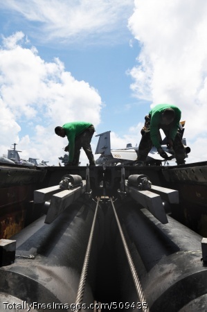 100927-N-7191M-011
PACIFIC OCEAN (Sept. 27, 2010) Aviation Boatswain's Mate (Equipment) David Cooper, left, from Atlanta, and Aviation Boatswain's Mate (Equipment) Ronell Day, from New Orleans, replace deck plates above one of the four steam-powered catapults aboard the aircraft carrier USS George Washington (CVN 73). George Washington, the Navy's only permanently forward-deployed aircraft carrier, is underway helping to ensure security and stability in the western Pacific Ocean. (U.S. Navy photo by Mass Communication Specialist 3rd Class Jacob D. Moore/Released)