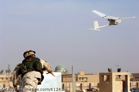 U.S. Army Sgt. Juan Rivera launches a Raven unmanned aerial vehi