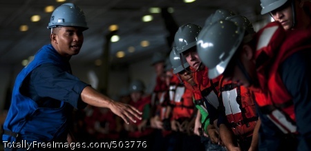110225-N-2055M-106
ARABIAN SEA (Feb. 25, 2011) Boatswain's Mate Seaman Jarvis Facey gives orders to Sailors as they man a line in the hangar bay aboard the Nimitz-class aircraft carrier USS Carl Vinson (CVN 70) during a replenishment at sea. The Carl Vinson Carrier Strike Group is deployed supporting maritime security operations and theater security cooperation efforts in the U.S. 5th Fleet area of responsibility. (U.S. Navy photo by Mass Communication Specialist 3rd Class Travis K. Mendoza /Released)