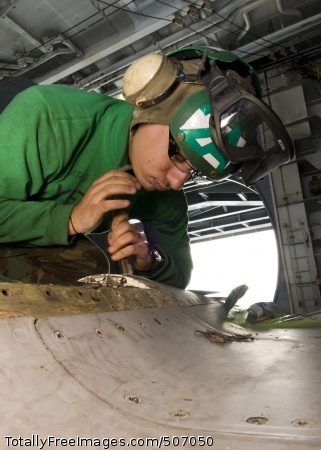 101126-N-9626Y-035
PACIFIC OCEAN (Nov. 26, 2010) Aviation Structural Mechanic 3rd Class Luke Spataro, from St. Louis, performs corrosion control on an F/A-18E Super Hornet aboard the aircraft carrier USS George Washington (CVN 73). George Washington is on patrol in the western Pacific Ocean helping to ensure security and stability. (U.S. Navy photo by Mass Communication Specialist Seaman Cheng S. Yang/Released) 