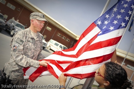 100911-F-3682S-018
KABUL, Afghanistan (Sept. 11, 2010) Fire Controlman 1st Class Andrew Eden, International Security Assistance Force (ISAF) Joint Command disclosure officer, left, and French Army Sgt. Lydia Briand prepare to raise the American Flag at Kabul International Airport in Afghanistan. (U.S. Air Force photo by Staff Sgt. Joseph Swafford/Released)