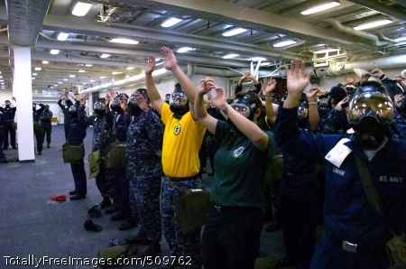 100914-N-2515C-097
SAN DIEGO (Sept. 14, 2010) Sailors raise their arms, signifying that they have successfully donned their MCU-2P gas mask during chemical, biological, and radiological (CBR) training aboard the amphibious transport dock USS Green Bay (LPD 20). The CBR training was held in preparation for the upcoming Unit-Level Training Assessment-Certification (Ultra-C). (U.S. Navy photo by Mass Communication Specialist 1st Class Larry S. Carlson/Released)