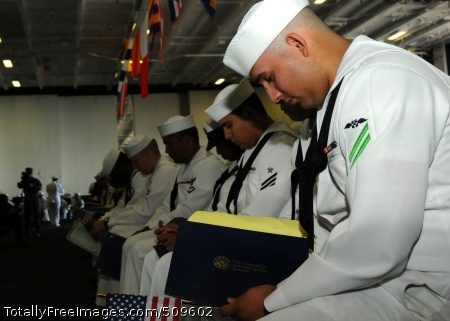 100920-N-7908T-053
NORFOLK (Sept. 20, 2010) A Sailor bows his head during the benediction for a naturalization ceremony aboard the aircraft carrier USS George H.W. Bush (CVN 77). Forty Sailors earned their American citizenship in the first naturalization ceremony ever held aboard George H.W. Bush. (U.S. Navy photo by Mass Communication Specialist 3rd Class Brent Thacker/Released)
