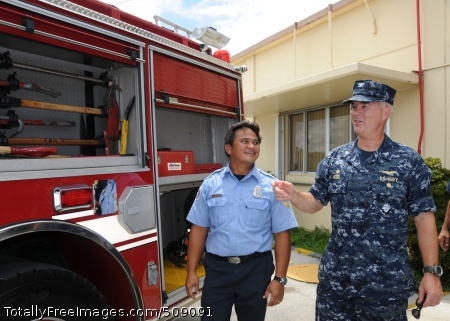 101001-N-1906L-025
SANTA RITA, Guam (Oct. 1, 2010) Capt. Richard Wood, right, commanding officer of U.S. Naval Base Guam (NBG), discusses the features of a new fire truck with Nicholas Perez, fire captain of NBG Ordnance Annex, following a ribbon cutting ceremony. (U.S. Navy photo by Jesse Leon Guerrero/Released)