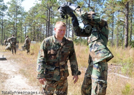 101015-N-9564W-173
CAMP SHELBY, Miss. (Oct. 15, 2010) Utilitiesman 2nd Class Charles Curry, assigned to the chemical, biological, radiological team from Naval Mobile Construction Battalion (NMCB) 74, removes the gas mask of an NMCB 26 Seabee during a simulated detailed troop decontamination as part of the battalion's Field Training Exercise. NMCB-74 is in the field at Camp Shelby, Miss. conducting their field training before deploying later this year. (U.S. Navy photo by Mass Communication Specialist 1st Class Ryan G. Wilber/Released) 