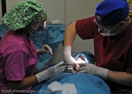 100910-N-2908M-014
MEDITERRANEAN SEA (Sept. 10, 2010) Lt. Christopher Parks removes a patient's wisdom teeth during oral surgery aboard the amphibious assault ship USS Kearsarge (LHD 3). The Kearsarge Amphibious Ready Group (ARG) is en route to Pakistan to help provide relief to flood-stricken regions. (U.S. Navy photo by Mass Communication Specialist 3rd Class Joshua Mann/Released)