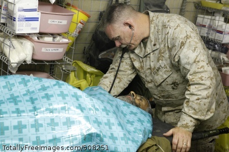 101023-M-7825S-019
SANGIN, Afghanistan (Oct. 23, 2010) Lt. Cmdr. Patrick Hare, assigned to Headquarters and Service Company, 3rd Battalion, 5th Marines, Regimental Combat Team 2, administers first aid to an Afghan man at Forward Operating Base Jackson. The battalion is one of the combat elements of Regimental Combat Team 2, conducting counter insurgency operations in partnership with the International Security Assistance Force (ISAF) in Afghanistan. (U.S. Marine Corps photo by Sgt. Artur Shvartsberg/ Released) 
