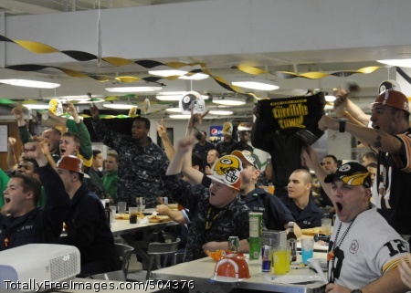 110207-N-6307R-031
ARABIAN SEA (Feb.7, 2011) Sailors in the mess decks aboard the aircraft carrier USS Carl Vinson (CVN 70) watch Super Bowl XLV. The Carl Vinson Carrier Strike Group is deployed supporting maritime security operations and theatre security cooperation efforts in the U.S. 5th Fleet area of responsibility. (U.S. Navy photo by Mass Communication Specialist 3rd Class Heather Roe/Released)