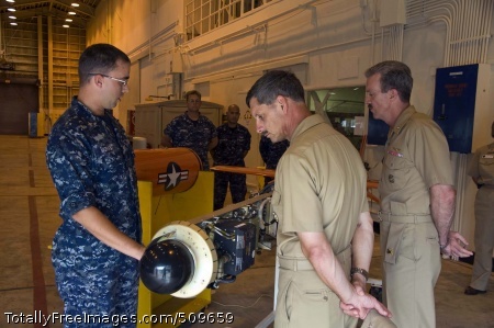 100917-N-6433N-122
OKINAWA, Japan (Sept. 17, 2010) Aviation Electronics Technician 2nd Class Jonathan Morast, left, assigned to the targets department at Commander, Fleet Activities, Okinawa, briefs Vice Adm. Michael Vitale, center, commander of Naval Installations Command, and Rear Adm. Richard Wren, right, commander of Naval Forces Japan, on the capabilities of the MK-117 jet assisted takeoff rocket at White Beach Naval Port Facility. Vitale visited Okinawa while on a scheduled visit of U.S. Naval installations throughout the Asia region. U.S. Navy photo by Mass Communication Specialist 2nd Class Rex Nelson/Released) 