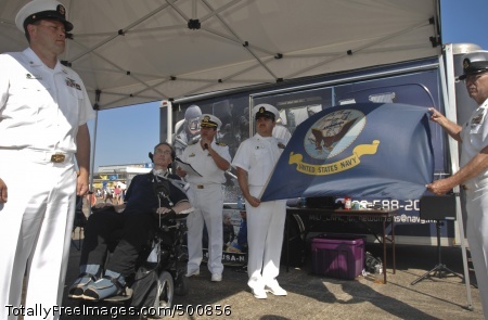 110507-N-1928O-057
BELLE CHASSE, La. (May 7, 2011) Capt. Tom Luscher, commander of Naval Air Station Joint Reserve Base Belle Chasse, delivers remarks at a ceremony honoring retired Navy Reserve Force Master Chief Tom Mobley as Master Chief Avionics Technician Marc Mayfield, left, Chief Aviation Electrician's Mate Tracy Acosta and Chief Aviation Electronics Technician Neil Strahan standby to present Mobley with a Navy flag flown in Afghanistan. Mobley, who was diagnosed with Lou Gehrig's disease shortly after retirement, served as Force Master Chief from July 2001 to June 2005. (U.S. Navy photo by Mass Communication Specialist 1st Class Mark O'Donald/Released) 