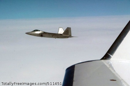 VER THE PACIFIC OCEAN - An F-22 Raptor fighters takes position alongside Fencing 1220, the target of interest for Exercise VIGILANT EAGLE, shortly after take-off, Aug. 8. VIGILANT EAGLE is a cooperative exercise involving the North American Aerospace Defense Command and the Russian Air Force. The exercise scenario creates a situation that requires both the Russian Air Force and NORAD to launch or divert fighter aircraft to investigate and follow a "hijacked" airliner. The exercise focuses on shadowing and the cooperative hand-off of the monitored aircraft between fighters of the participating nations.