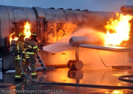 110426-N-IQ276-001
PENSACOLA, Fla. (April 26, 2011) Members of the Fire Emergency Service Gulf Coast Mobile Training Team, based at Naval Air Station Pensacola, work with Naval Construction Battalion Center firefighters during a semi-annual training exercise. The firefighters battled live fires on the Mobile Aircraft Firefighting Training Device, a simulated aircraft that can simulate 13 different fires that can happen aboard an aircraft. (U.S. Navy photo by Equipment Operator Constructionman Devida Pope/Released)