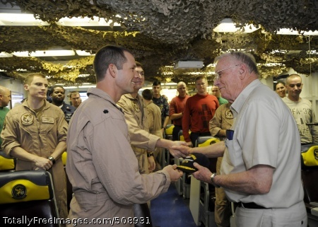 101009-N-3705H-015
ARABIAN SEA (Oct. 9, 2010) Cmdr. Chad Vincelette, executive officer of the Swordsmen of Strike Fighter Squadron (VFA) 32, gives a Swordsmen ball cap to retired astronaut Neil Armstrong during the Legends of Aerospace tour aboard the aircraft carrier USS Harry S. Truman (CVN 75). The Harry S. Truman Carrier Strike Group is deployed in support of maritime security operations and theater security cooperation efforts in the U.S. 5th Fleet area of responsibility. (U.S. Navy photo by Mass Communication Specialist 3rd Class Nina Hughes/Released)