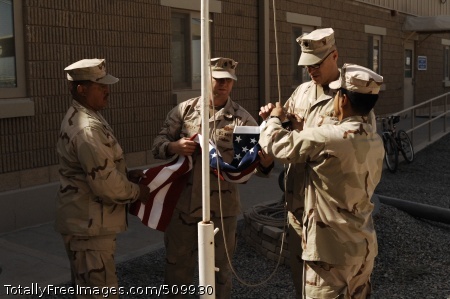 100911-N-9958G-007
CAMP ARIFJAN, Kuwait (Sept. 11, 2010) Cmdr. Marquez Campbell, left, Chief Hospital Corpsman Anthony Gourley, Cmdr. Craig Womeldorph and Senior Chief Logistics Specialist Jorge Macias prepare to raise the American flag over Expeditionary Medical Facility Kuwait (EMF-K) on Sept. 11, 2010, as part of the ninth anniversary commemoration of the terrorist attacks in New York City, Washington, D.C., and Somerset, Pa., in 2001. (U.S. Navy photo by Chief Mass Communication Specialist Bill Gowdy/Released)
