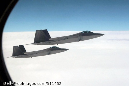 VER THE PACIFIC OCEAN - A pair of F-22 Raptor fighters intercept Fencing 1220, the target of interest for Exercise VIGILANT EAGLE, shortly after take-off, Aug. 8. VIGILANT EAGLE is a cooperative exercise involving the North American Aerospace Defense Command and the Russian Air Force. The exercise scenario creates a situation that requires both the Russian Air Force and NORAD to launch or divert fighter aircraft to investigate and follow a "hijacked" airliner. The exercise focuses on shadowing and the cooperative hand-off of the monitored aircraft between fighters of the participating nations.