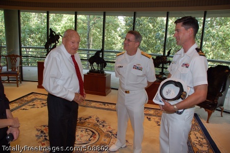 101012-N-6778P-006
ATLANTA (Oct. 12, 2010) Rear Adm. Michael Yurina, center, deputy director of Submarine Security and Technology, Submarine Warfare Division, speaks with S. Truett Cathy, left, Chick-fil-A Owner and Founder, during a tour of the Chick-fil-A corporate headquarters in Atlanta as part of Atlanta Navy Week 2010. Atlanta Navy Week is one of 19 Navy weeks scheduled in 2010. Navy weeks show Americans the investment they have made in their Navy and increase awareness in cities that do not have a significant Navy presence. (U.S. Navy photo by Mass Communication Specialist 1st Class Ruben Perez/Released) 
