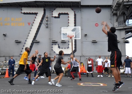 100925-N-2013O-225
PACIFIC OCEAN (Sept. 25, 2010) A Sailor shoots a basket while playing a 3-on-3 basketball game during a steel beach picnic aboard the aircraft carrier USS George Washington (CVN 73). Steel beach picnics provide Sailors an opportunity to relax after being underway for prolonged periods of time. George Washington, the Navy's only permanently forward-deployed aircraft carrier is underway helping to ensure security and stability in the western Pacific Ocean. (U.S. Navy photo by Mass Communication Specialist 3rd Class Charles Oki/Released) 