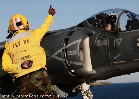100914-N-7508R-166
ATLANTIC OCEAN (Sept. 14, 2010) Aviation Boatswain's Mate (Handling) 1st Class Rodrickus Shepherd, from Covington, Calif., the flight deck's assistant leading petty officer, gives an AV-8B Harrier pilot assigned to the Marine Attack Squadron (VMA) 233 a thumbs up prior to his launch from the flight deck of the multi-purpose amphibious assault ship USS Bataan (LHD 5). Bataan is underway conducting portions of a basic-training phase, including an aviation certification that will allow the ship to launch and recover aircraft. (U.S. Navy photo by Mass Communication Specialist 2nd Class Julio Rivera/Released)