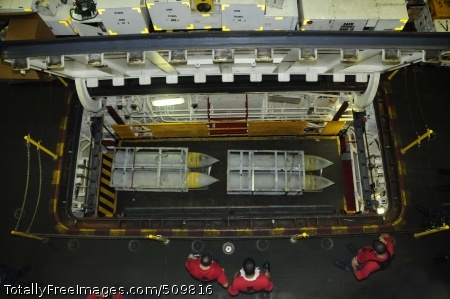 100913-N-2918M-093
PACIFIC OCEAN (Sept. 13, 2010) Sailors assigned to the Weapons Department aboard the aircraft carrier USS Nimitz (CVN 68) raise ordnance on the weapons elevator in the hangar bay for an offload. Nimitz is conducting blue water operations in the U.S. 3rd Fleet area of responsibility. (U.S. Navy photo by Mass Communication Specialist 3rd Class Peter Merrill/Released) 