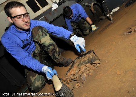 110328-N-6567V-025
PACIFIC OCEAN (March 28, 2011) Airman Michael Gentile, from Tampa, Fla., sweeps up rust in the hangar bay aboard the aircraft carrier USS George Washington (CVN 73) to prepare the surface for priming and painting. George Washington departed from her forward operating port of Commander, Fleet Activities Yokosuka in response to the complex nature of the disaster that struck Japan on March 11. (U.S. Navy photo by Mass Communication Specialist 3rd Class Marcos Vazquez/Released)