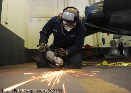 101003-N-6427M-073
ARABIAN SEA (Oct. 3, 2010) Aviation Boatswain's Mate (Handling) Airman Juan Jauregui, from New York, grinds paint off hangar bay door tracks aboard the aircraft carrier USS Harry S. Truman (CVN 75). The Harry S. Truman Carrier Strike Group is deployed supporting maritime security operations and theater security cooperation efforts in the U.S. 5th Fleet area of responsibility. (U.S. Navy photo by Mass Communication Specialist Seaman Ryan McLearnon/Released)