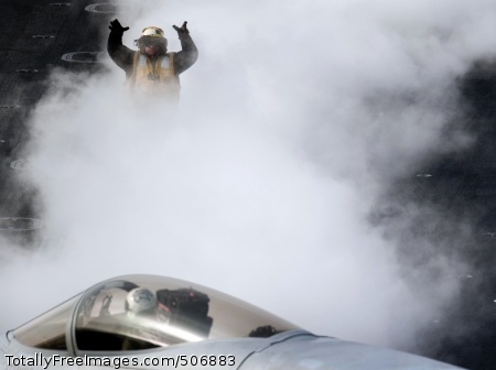 101202-N-7981E-331
PACIFIC OCEAN (Dec. 2, 2010) An aircraft director guides the pilot of an F/A-18C Hornet onto a steam-powered catapult aboard the aircraft carrier USS Carl Vinson (CVN 70). Carl Vinson and Carrier Air Wing (CVW) 17 are on a three-week composite training unit exercise followed by a deployment to the western Pacific Ocean. (U.S. Navy photo by Mass Communication Specialist 2nd Class James R. Evans/Released)