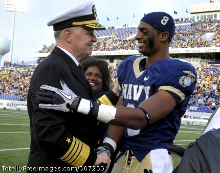 101120-N-8273J-301
ANNAPOLIS, Md. (Nov. 20, 2010) Chief of Naval Operations (CNO) Adm. Gary Roughead congratulates Navy safety Wyatt Middleton (8) and the rest of the senior class players prior to the Naval Academy football game against Arkansas State at the Navy/Marine Corps Memorial Stadium in Annapolis. The Midshipmen beat the Red Wolves, 35-19. (U.S. Navy photo by Chief Mass Communication Specialist Tiffini Jones Vanderwyst/Released)
