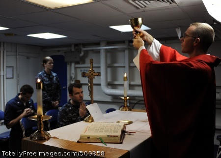 100914-N-4973M-014
PACIFIC OCEAN (Sept. 14, 2010) Lt. Benton Garrett, from Ingleside, Texas, a chaplain aboard the aircraft carrier USS Abraham Lincoln (CVN 72), raises the chalice in the ship's chapel during Catholic Mass. Abraham Lincoln is deployed as part of the Abraham Lincoln Carrier Strike Group conducting maritime security operations and theater security cooperation efforts. (U.S. Navy photo by Mass Communication Specialist 2nd Class Brian Morales/Released)