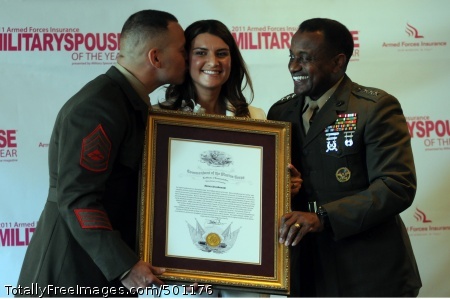 110505-N-AD372-169
WASHINGTON (May 5, 2011) Bianca Strzalkowski, center, along with her husband, Gunnery Sgt. Ronald Strzalkowski, receives the 2011 Military Spouse of the Year award. (U.S. Navy photo by Mass Communication Specialist 1st Class Abraham Essenmacher/Released)