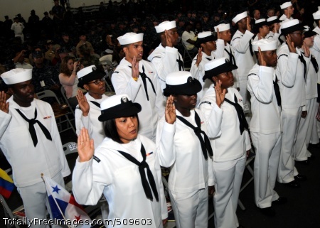 100920-N-6632S-068
NOROLK (Sept. 20, 2010) Sailors raise their right hands while reciting the oath of citizenship during a naturalization ceremony in the hangar bay of the aircraft carrier USS George H.W. Bush (CVN 77). Forty Sailors earned their American citizenship in the first naturalization ceremony ever held aboard George H.W. Bush. (U.S. Navy photo by Mass Communication Specialist Seaman Kevin J. Steinberg/Released)