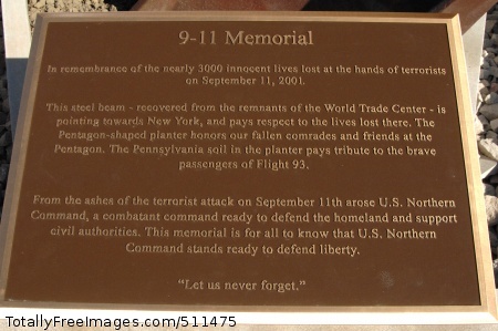 PETERSON AIR FORCE BASE, Colo. - The plaque of the new 9-11 memorial describes the design of the memorial and its three parts, the steel beam representing the World Trade Center, the five-sided planter representing the Pentagon, and Pennsylvania soil representing crash site of Flight 93. The memorial will be commemorated in a ceremony at 1 p.m. May 18.