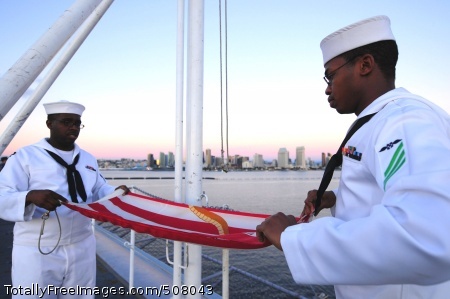101030-N-8040H-185
SAN DIEGO (Oct. 30, 2010) Aviation Boatswain's Mate (Equipment) Airman Kelston Moore and Logistics Specialist Seaman Corachel Patton fold the Union Jack during evening colors aboard the aircraft carrier USS Carl Vinson (CVN 70). (U.S. Navy photo by Mass Communication Specialist Seaman Christopher K. Hwang/Released)