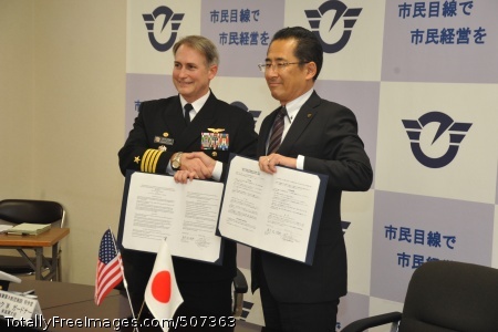 101117-N-8730P-146
FUJISAWA, Japan (Nov. 17, 2010) Capt. Eric Gardner, left, commanding officer of Naval Air Facility Atsugi, and Fujisawa City Mayor Yasunori Ebine shake hands after signing a memorandum of understanding at Fujisawa City Hall. The memorandum outlines what Naval Air Facility Atsugi can do for Fujisawa City during and after major crises such as a typhoon or earthquake. The three-year goal for the naval air facility is to have a signed memorandum of understanding with all of the cities surrounding the installation. (U.S. Navy photo by Mass Communication Specialist 1st Class Charles Panter/Released) 